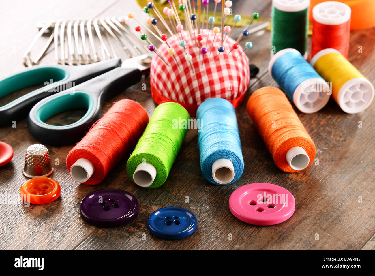 Composition with tailor accessories on wooden table Stock Photo