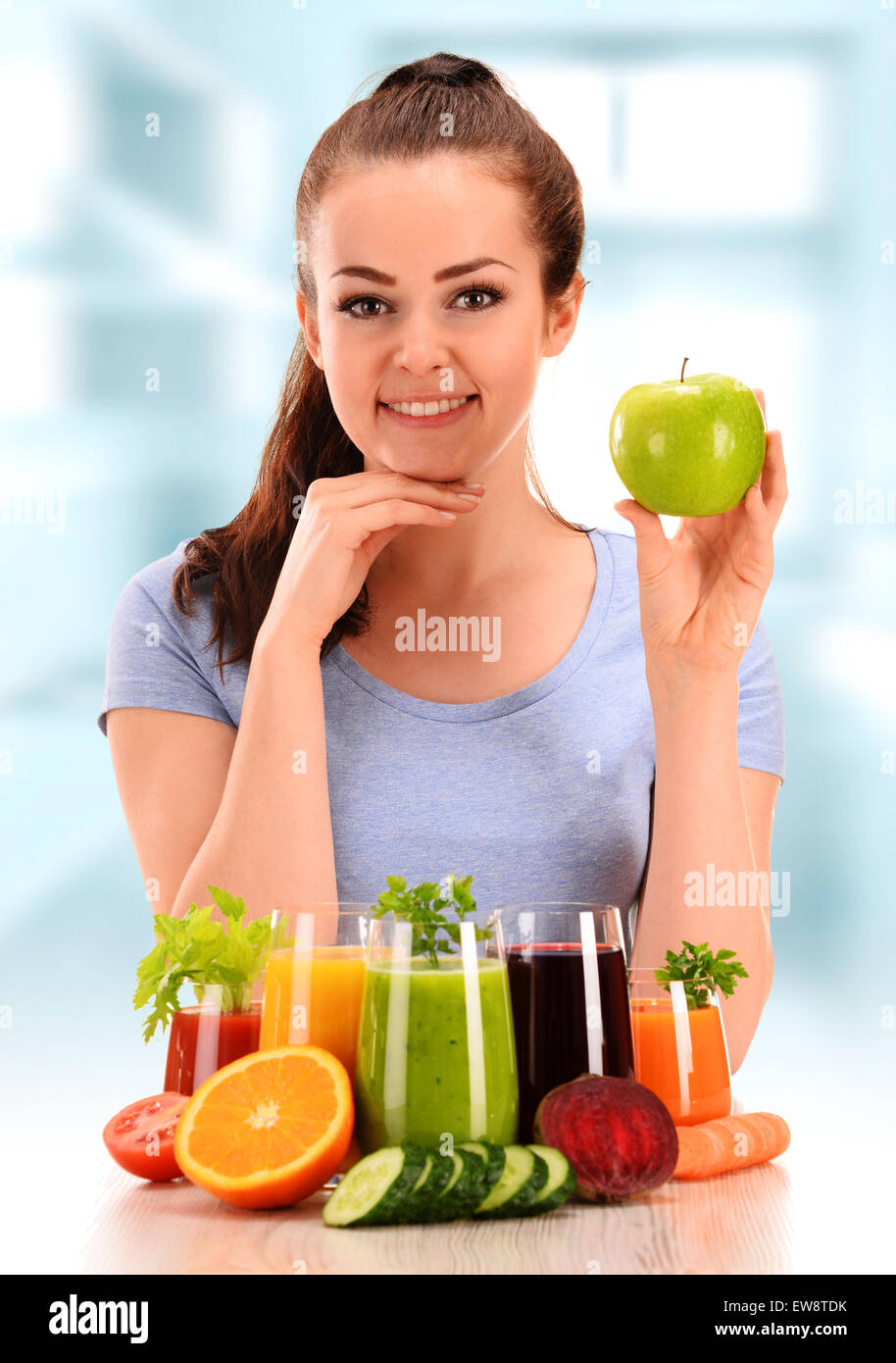 Young woman with variety of vegetable and fruit juices. Detox diet