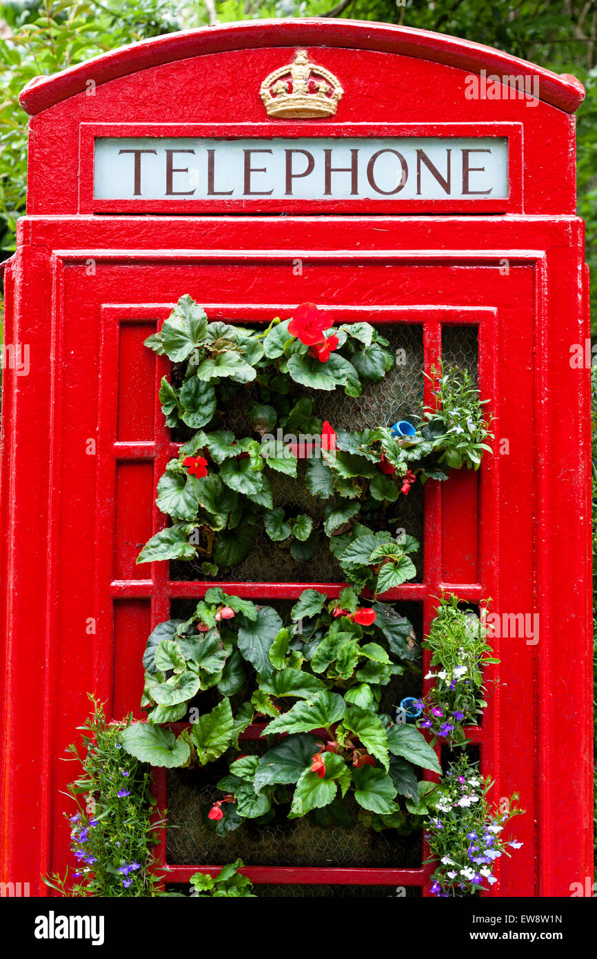 Orston, Nottinghamshire, U.K. 20th June, 2015. A dull dry day with temperatures of 18C at the Orston Open Gardens Day.  Residents of the Nottinghamshire  village have turned a redundant  red telephone box into a giant floral display. The traditional telephone box was installed in  2014 after its predecessor, which  had stood  in the village for more than 70 years, was demolished by a bus.  Credit:  Mark Richardson/Alamy Live News Stock Photo