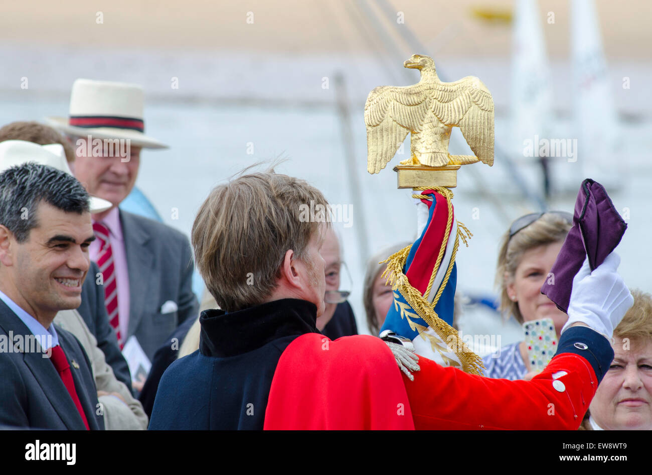 Broadstairs, Kent. 20th June, 2015. In commemoration of events after the Battle of Waterloo, a despatch is being carried from Belgium to London between 18 and 21 June. This morning, the despatch arrived at Broadstairs, Kent, carried by characters representing Major Henry Percy and Commander James White RN who brought the original despatch in 1815. Major Percy with the despatch and a captured French Eagle. Credit:  Paul Martin/Alamy Live News Stock Photo