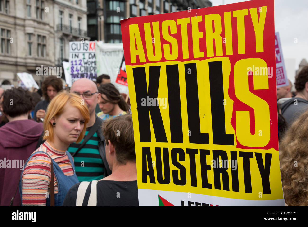 London, UK. Saturday 20th June 2015. People's Assembly against austerity demonstration through Central London. 250,000 people gathered to protest in a march through the capital protesting against the Tory cuts, holding placards and banners. People gathering in Parliamnet Sq for the rally. Credit:  Michael Kemp/Alamy Live News Stock Photo