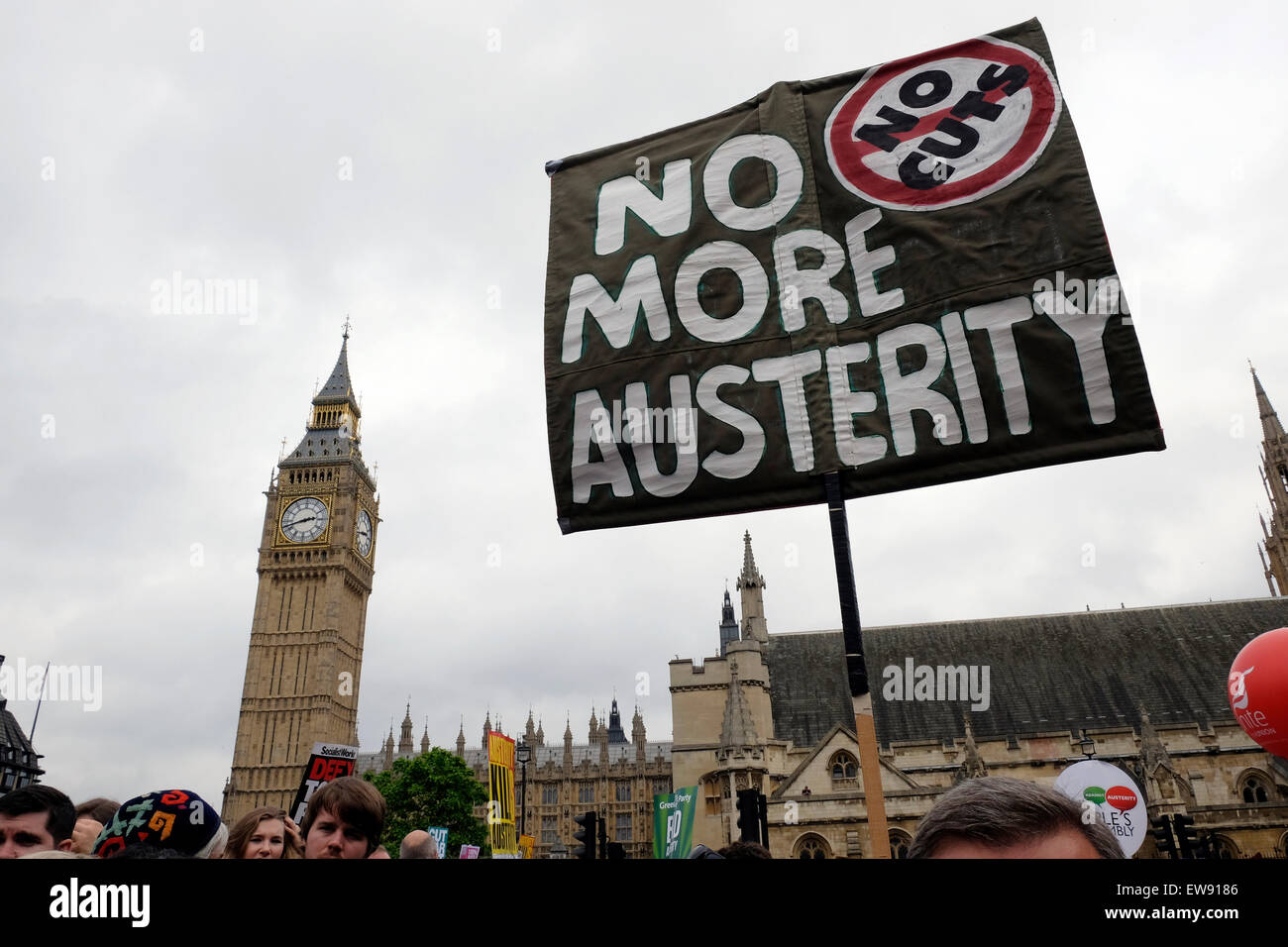 A banner reading ' No more austerity' Parliament Square, London Stock Photo