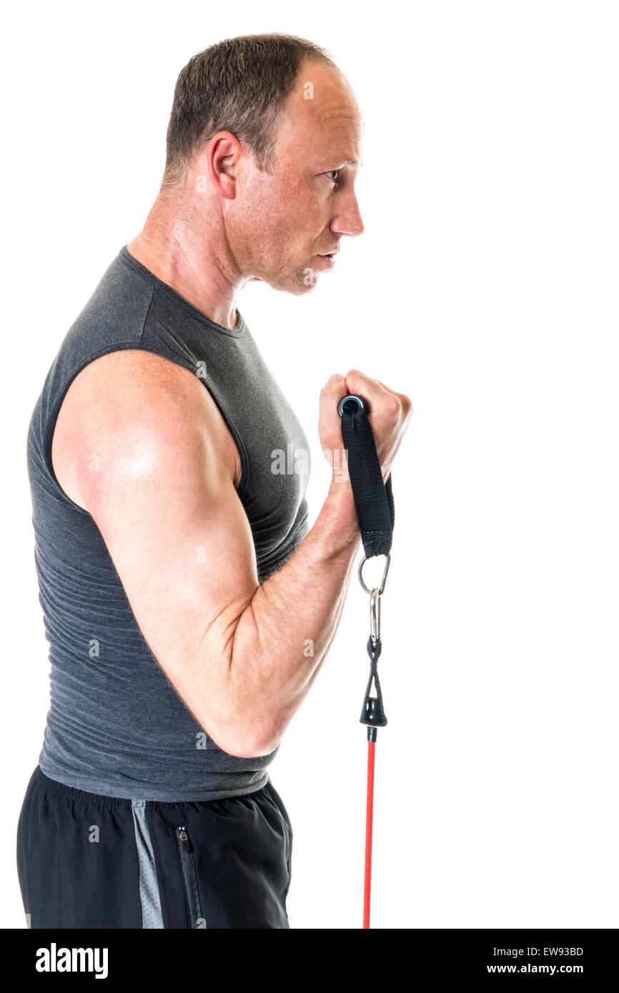 Bicep curl exercise with resistance band. Studio shot over white. Stock Photo