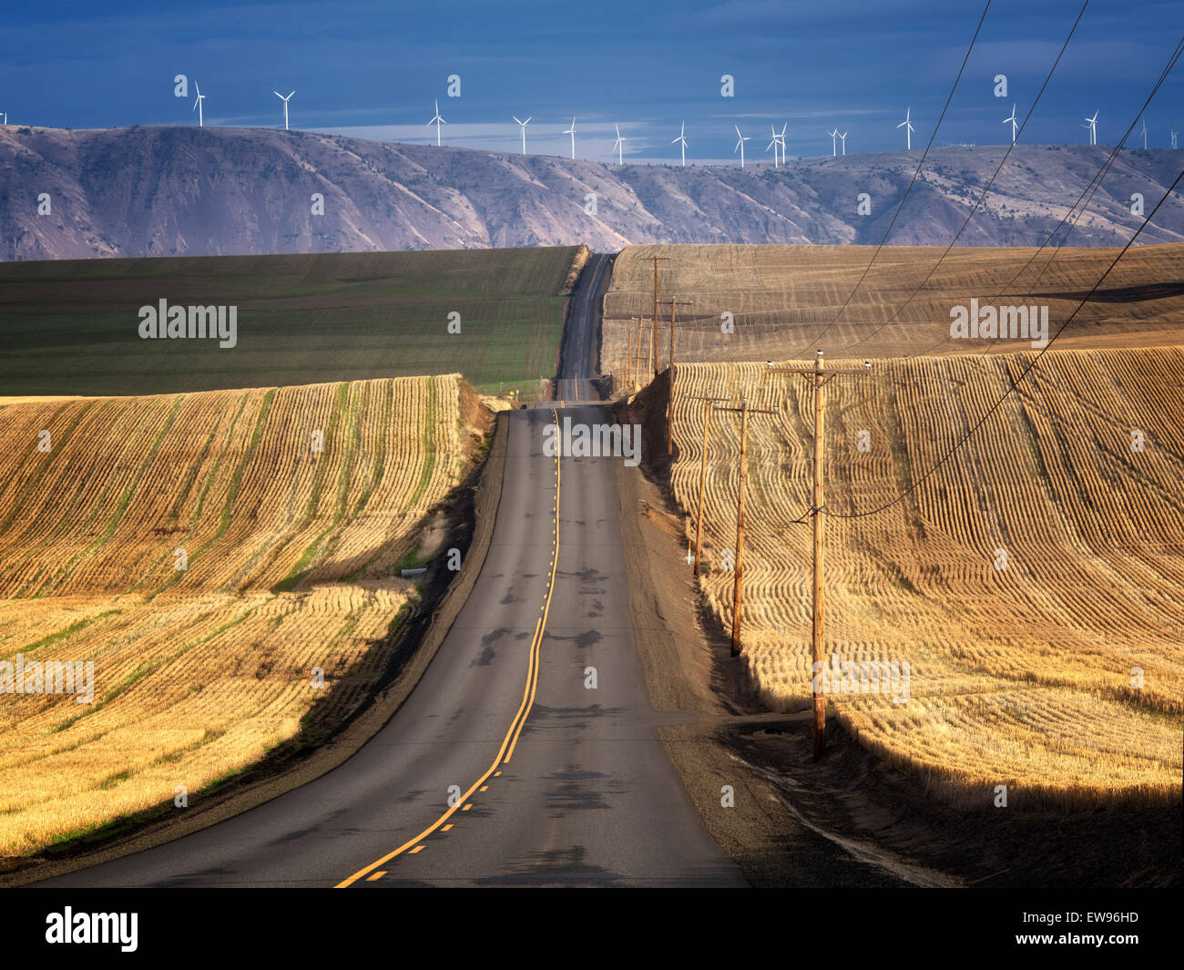 Backroad and wind turbines in Sherman County near the Columbia River Gorge, Oregon Stock Photo