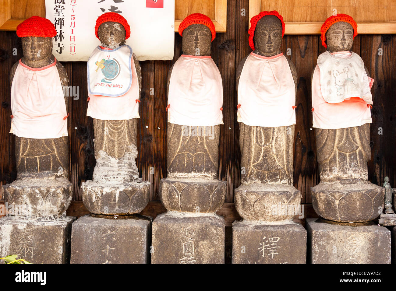 Japan, Onomichi, Hodoji temple. Facing row of five stone Japanese jizo