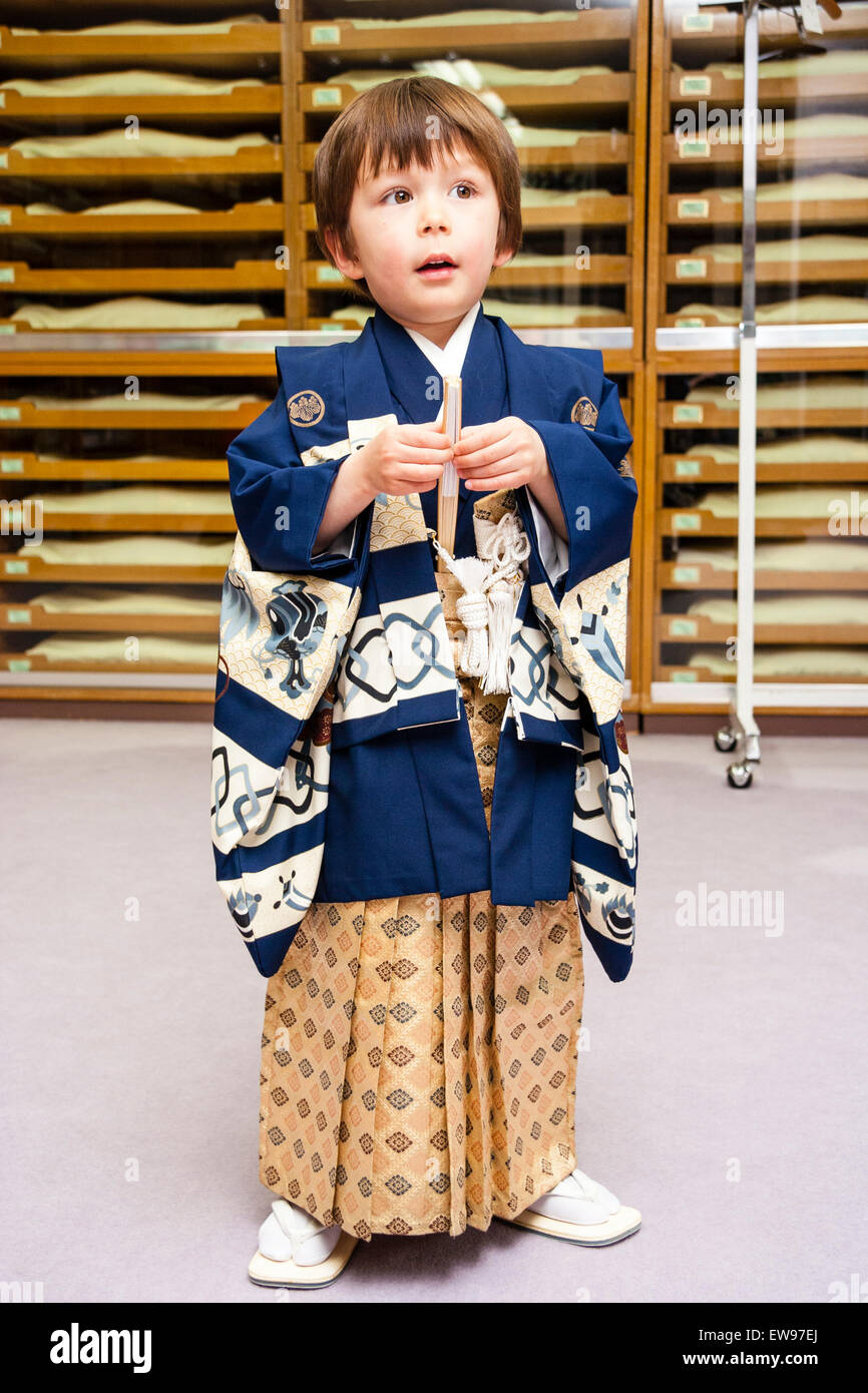 Mixed race English-Japanese child, boy, 5 year old, standing indoors  wearing full traditional Japanese male kimono for his shichi-go-san  ceremony Stock Photo - Alamy
