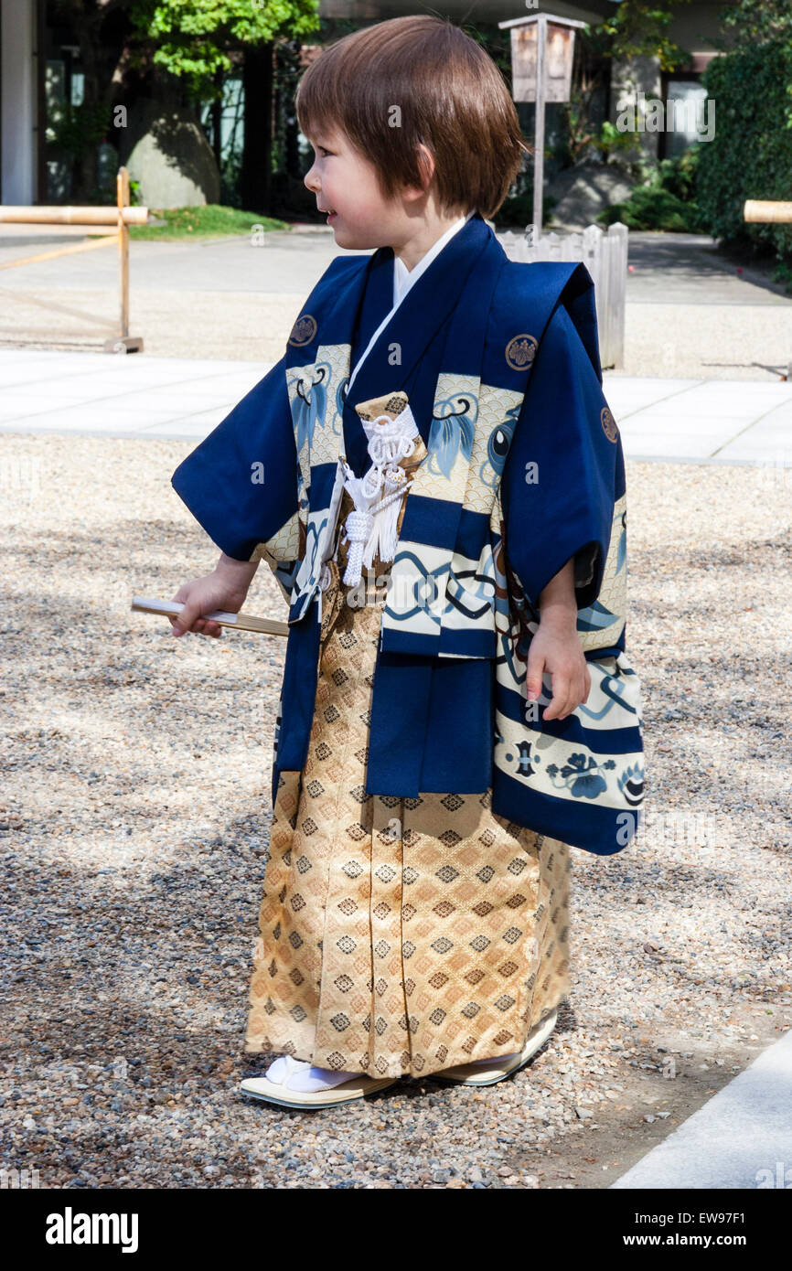 Caucasian child, boy, 5 year old, dressed in Japanese kimono and treading  carefully through Shinto shrine courtyard as if creeping without a sound  Stock Photo - Alamy