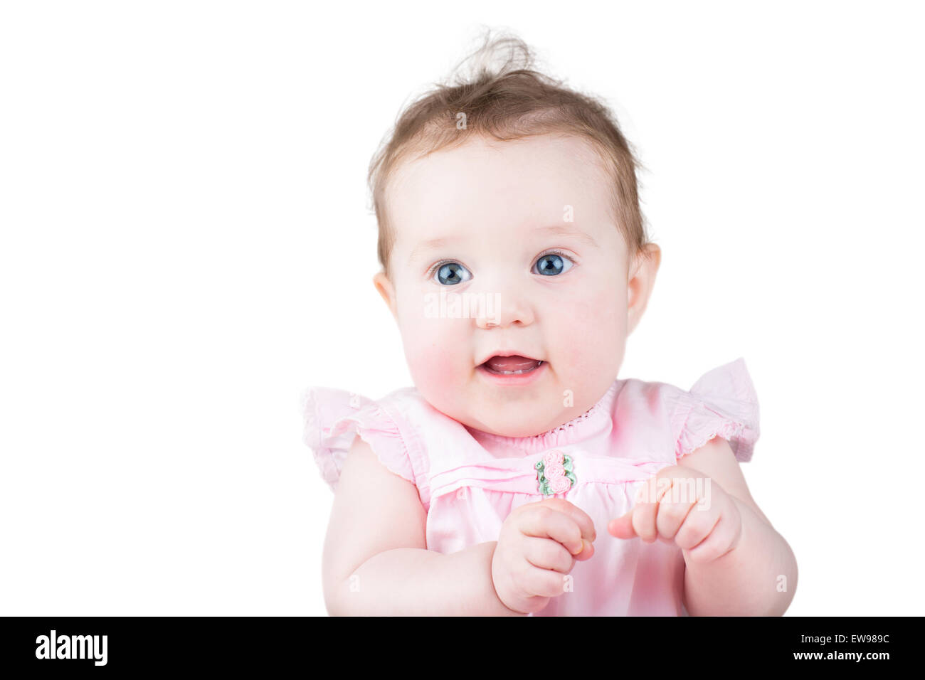 Close up portrait of a beautiful baby girl in a pink dress, isolated on white Stock Photo