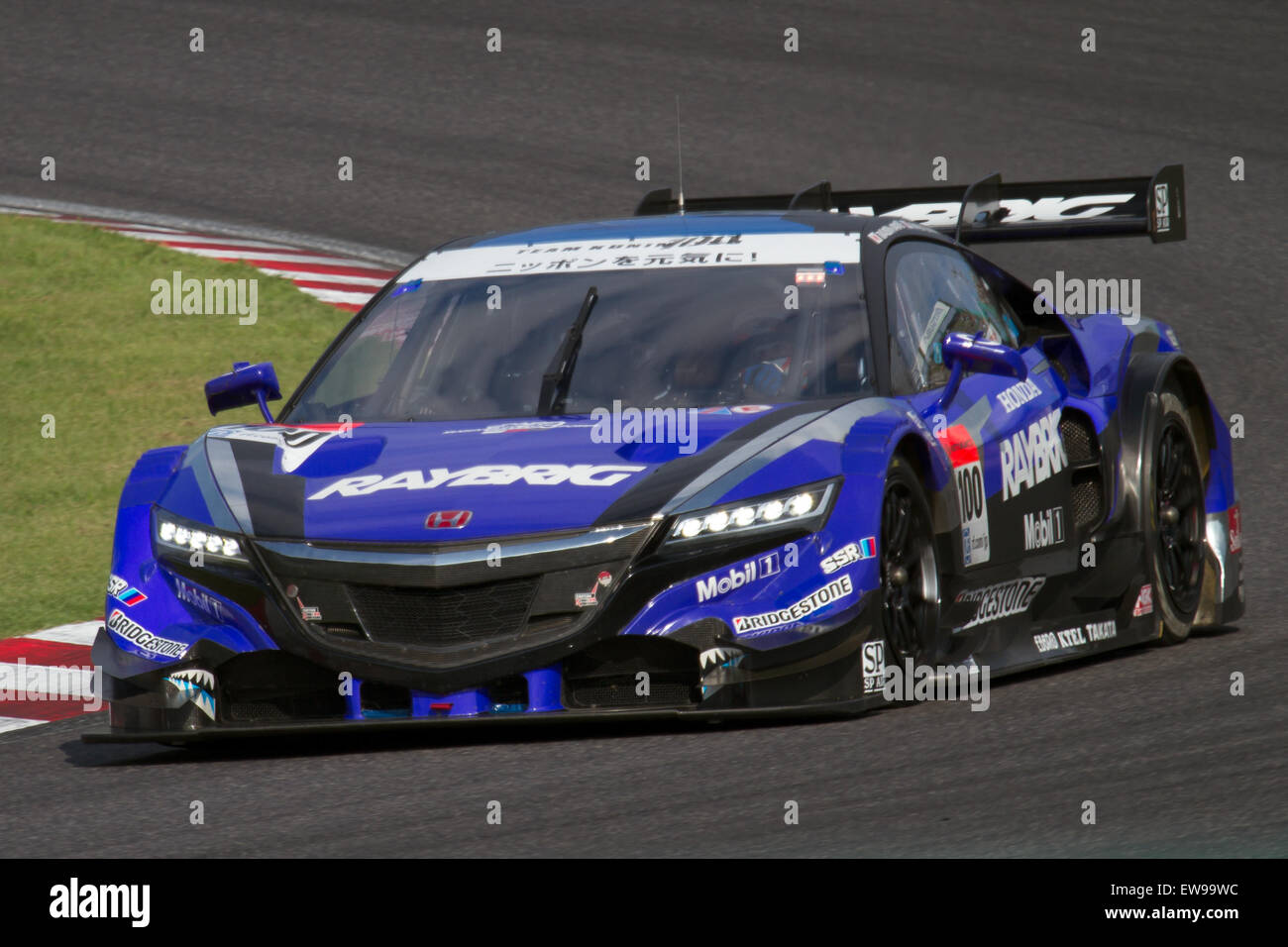 Takashi Kogure participated in the 2014 Super GT series at Suzuka Circuit, driving for the Super GT team. The image captures him during the Q2 qualifying session, where he competed for a position in the race. The Super GT series is known for its high-speed competition and skilled drivers. Stock Photo