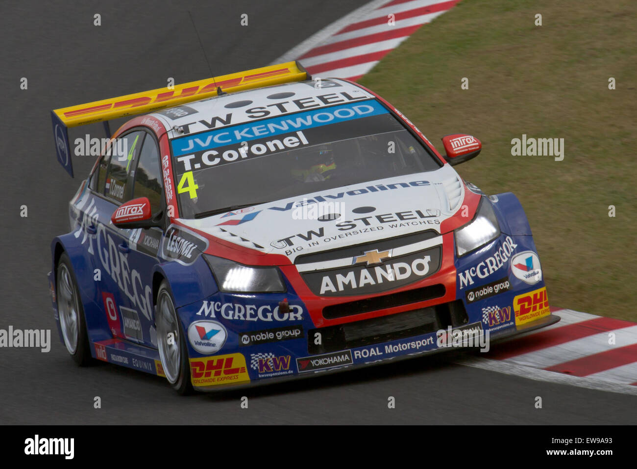 Tom Coronel competes in the 2014 WTCC Race of Japan, during the second qualifying session. The image captures the high-speed action of the event, highlighting Coronel's performance in the World Touring Car Championship. Stock Photo