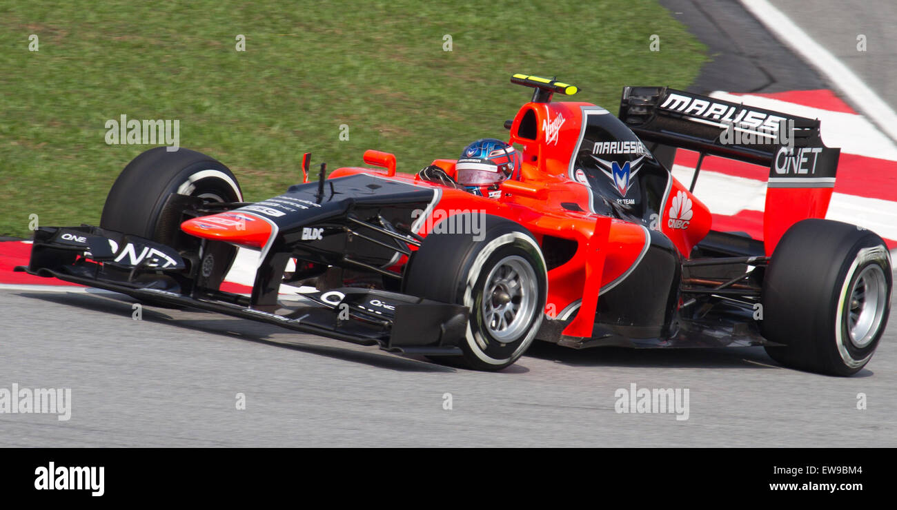 A photograph of Charles Pic during his qualifying session for the 2012 Malaysian Grand Prix. The image shows Pic in his Formula 1 car as he prepares for the race weekend. Stock Photo