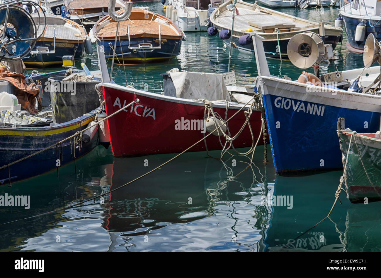 Small and colorful fishing boats in harbor Stock Photo - Alamy