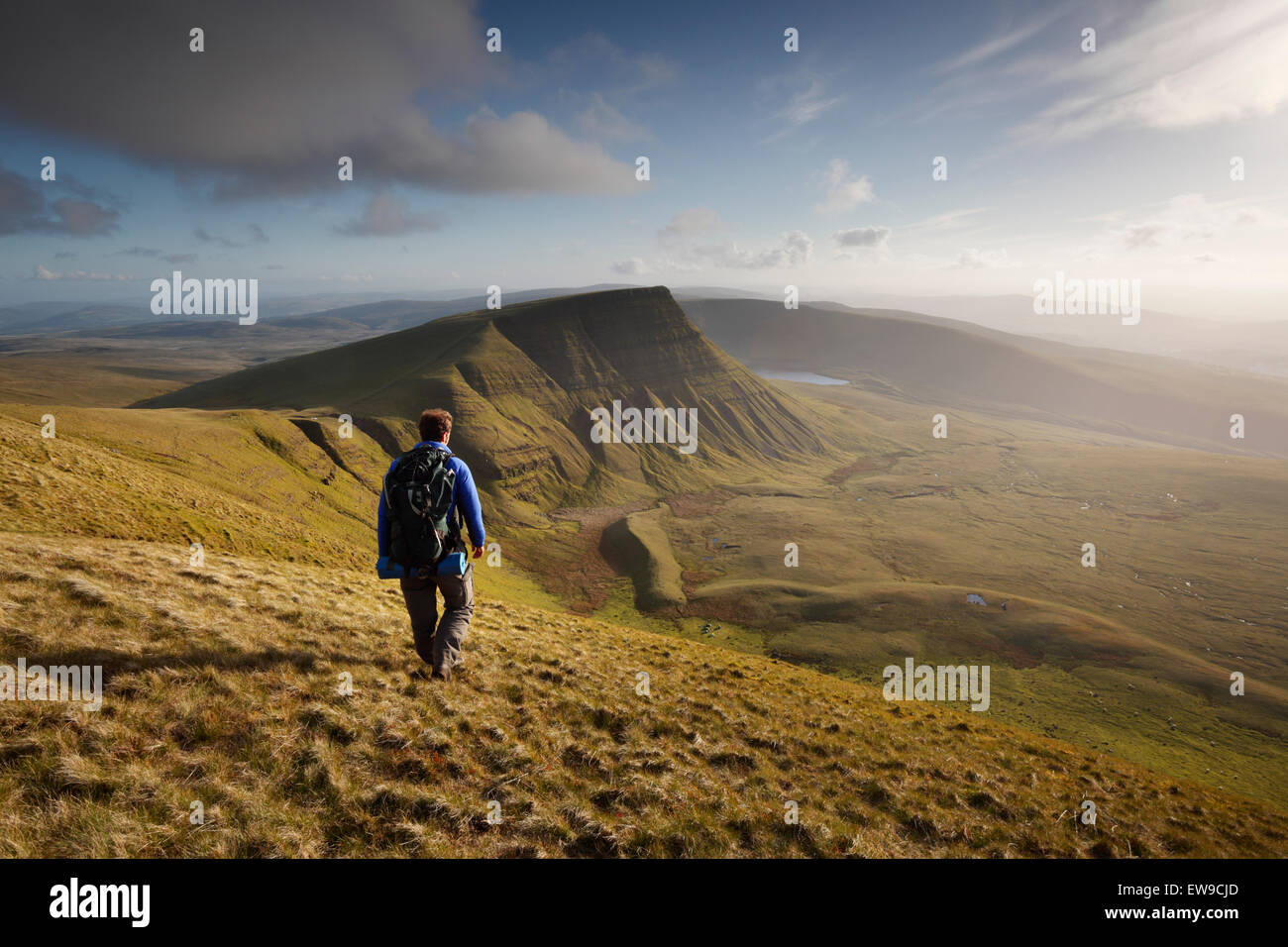 Hiker on Fan Foel heading for Picws Du. The Black Mountain. Brecon Beacons National Park. Carmarthenshire. Wales. UK. Stock Photo