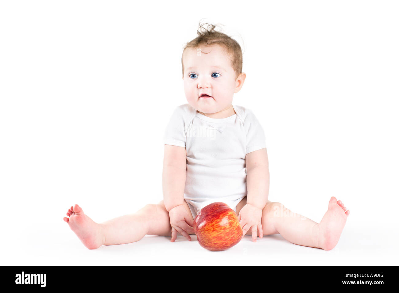 Cute baby playing with an apple Stock Photo