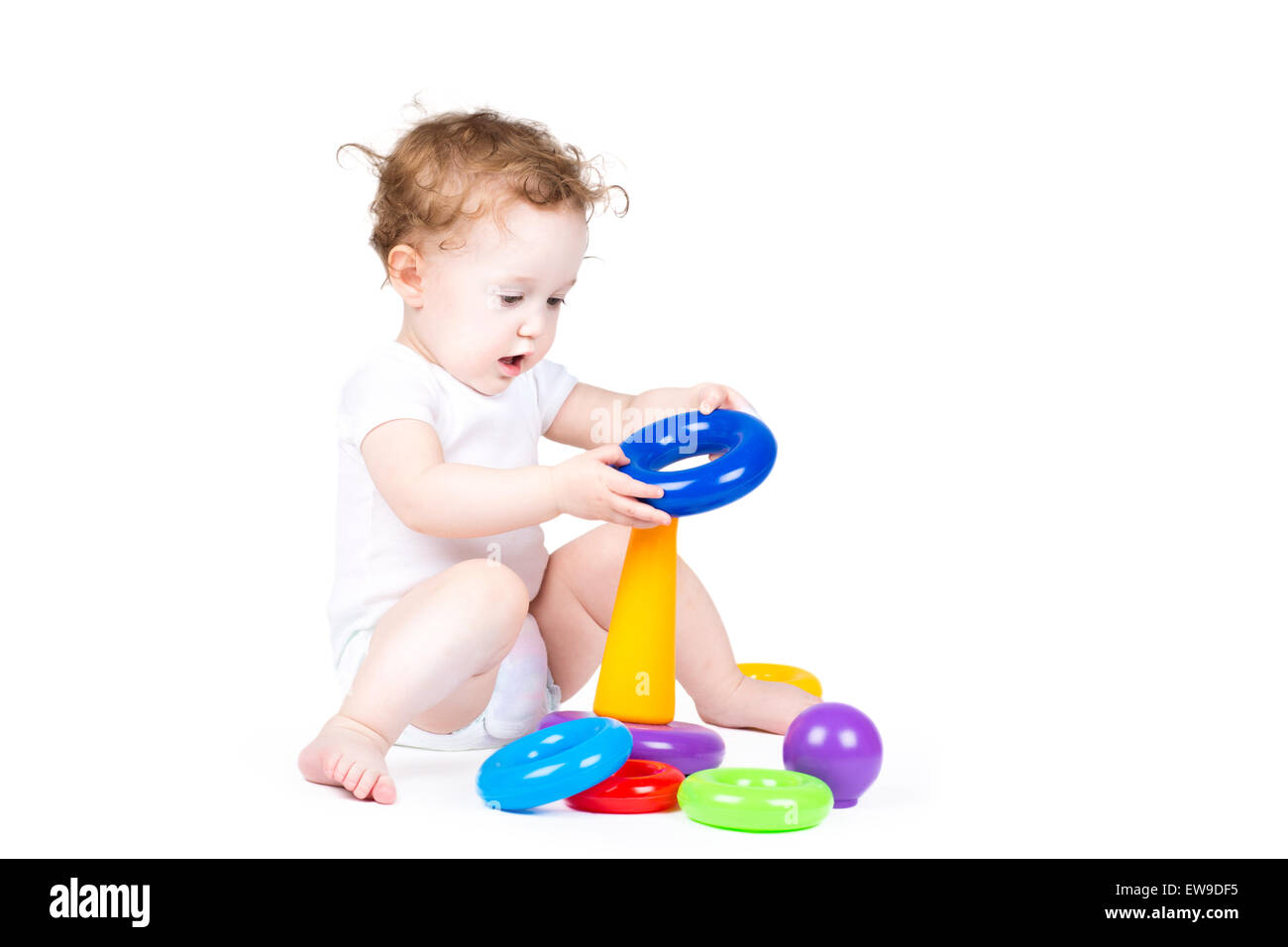 Cute baby playing with a plastic pyramid Stock Photo