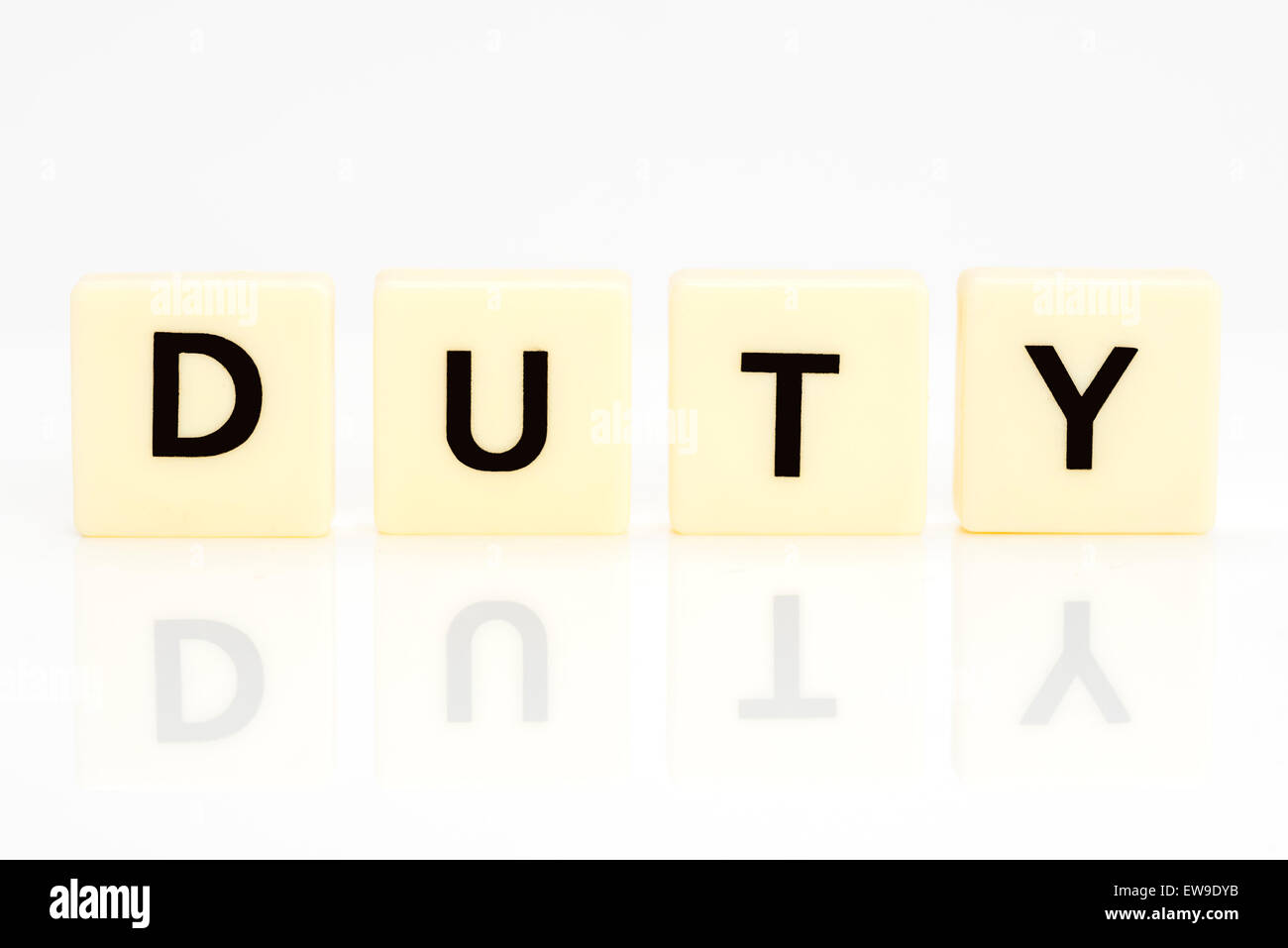 Generic letter tiles on a white background with reflection spelling the word duty Stock Photo