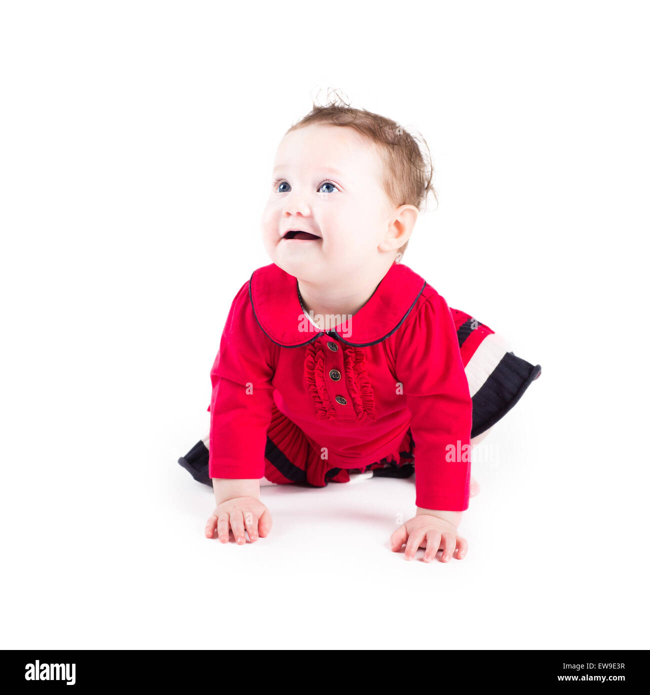 Funny crawling baby girl in a red dress Stock Photo Alamy