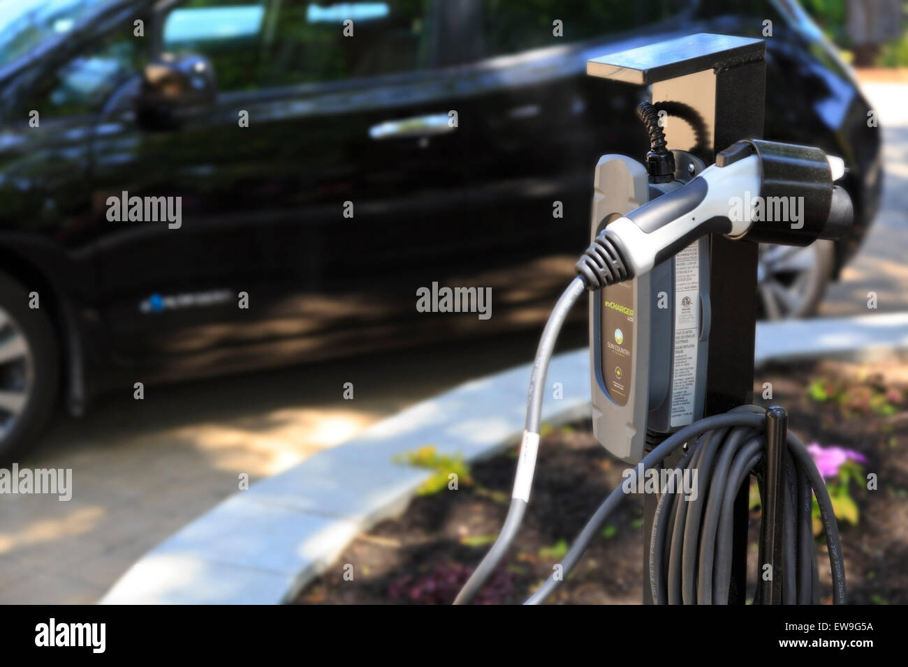 Charging station for electric vehicles with electric vehicle in