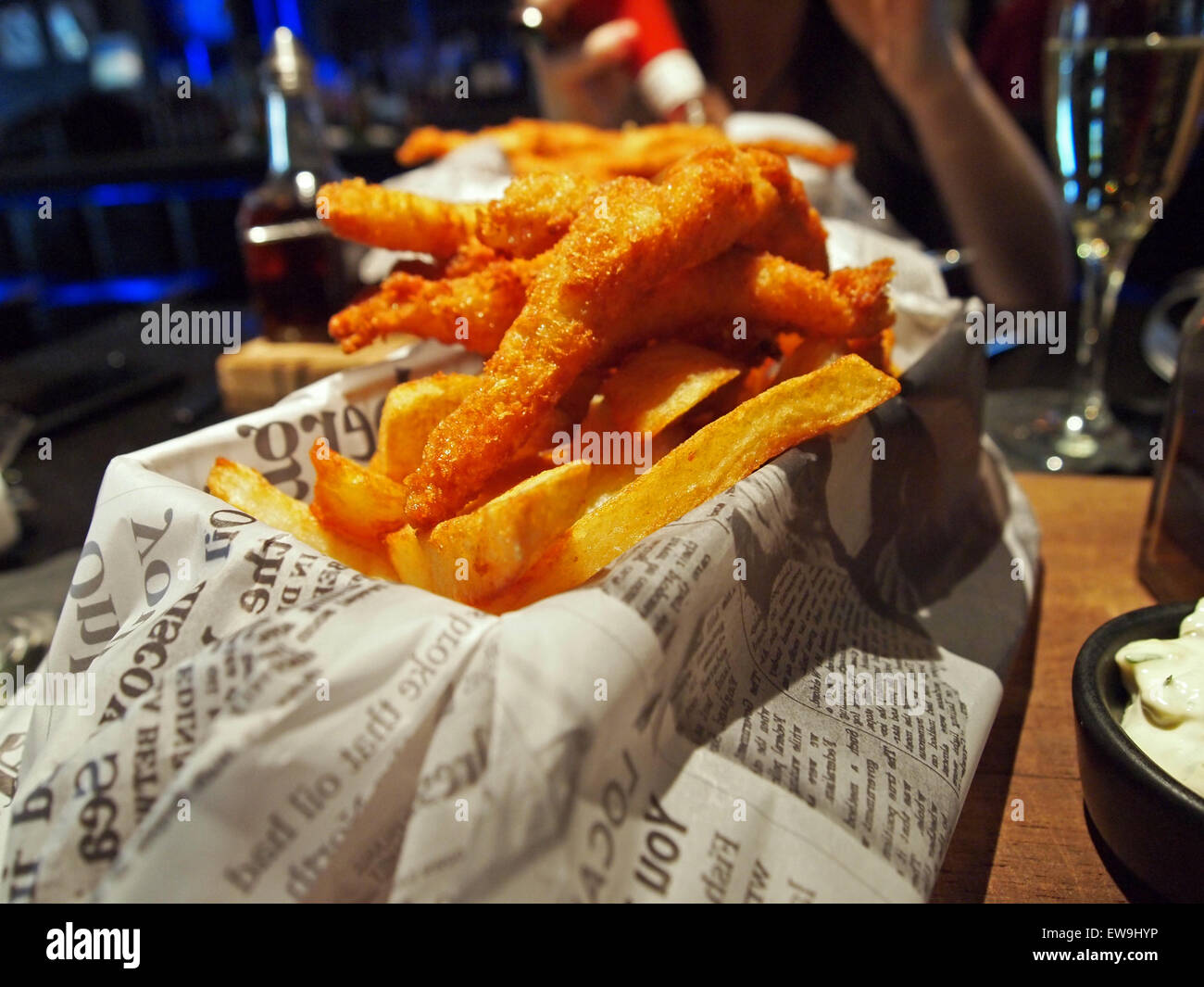 lemon sole goujons with chips on newspaper Stock Photo Alamy