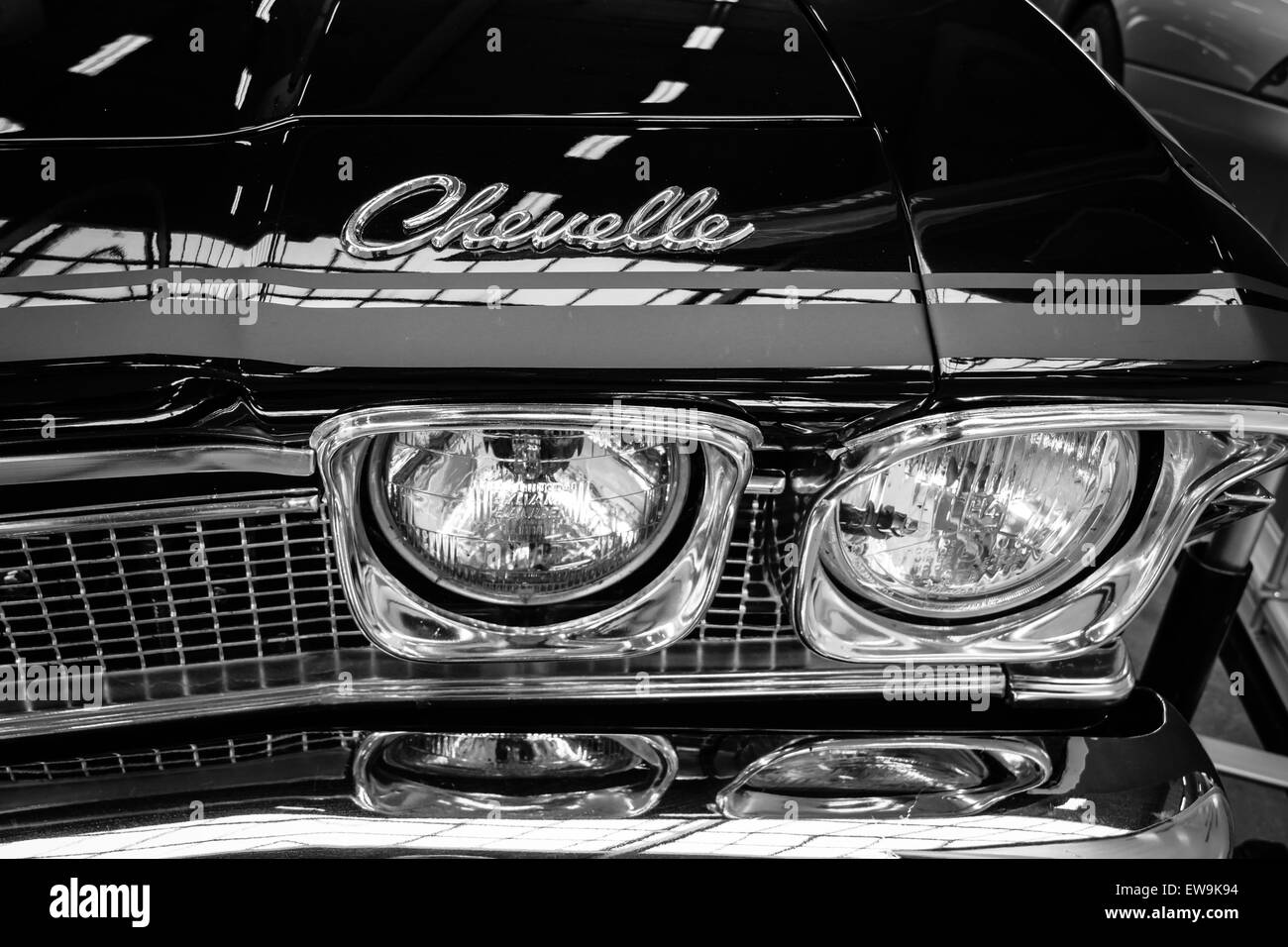 Headlamp of a mid-size car Chevrolet Chevelle. Black and white. The oldtimer show in MAFZ. Stock Photo