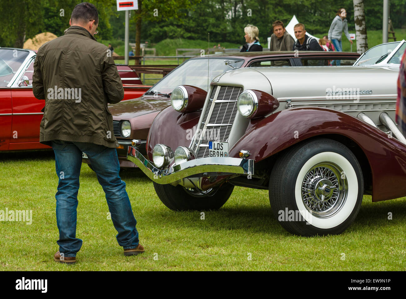 PAAREN IM GLIEN, GERMANY - MAY 23, 2015: A man looks at vintage car Auburn 852 Speedster. The oldtimer show in MAFZ. Stock Photo