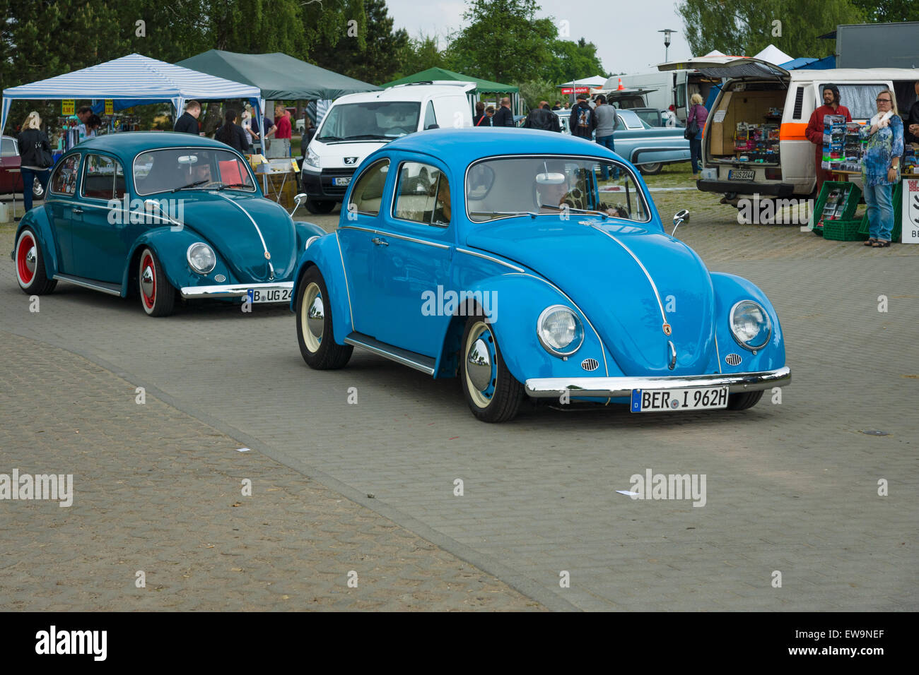 PAAREN IM GLIEN, GERMANY - MAY 23, 2015: Vintage cars VW Beetle on the road. The oldtimer show in MAFZ. Stock Photo