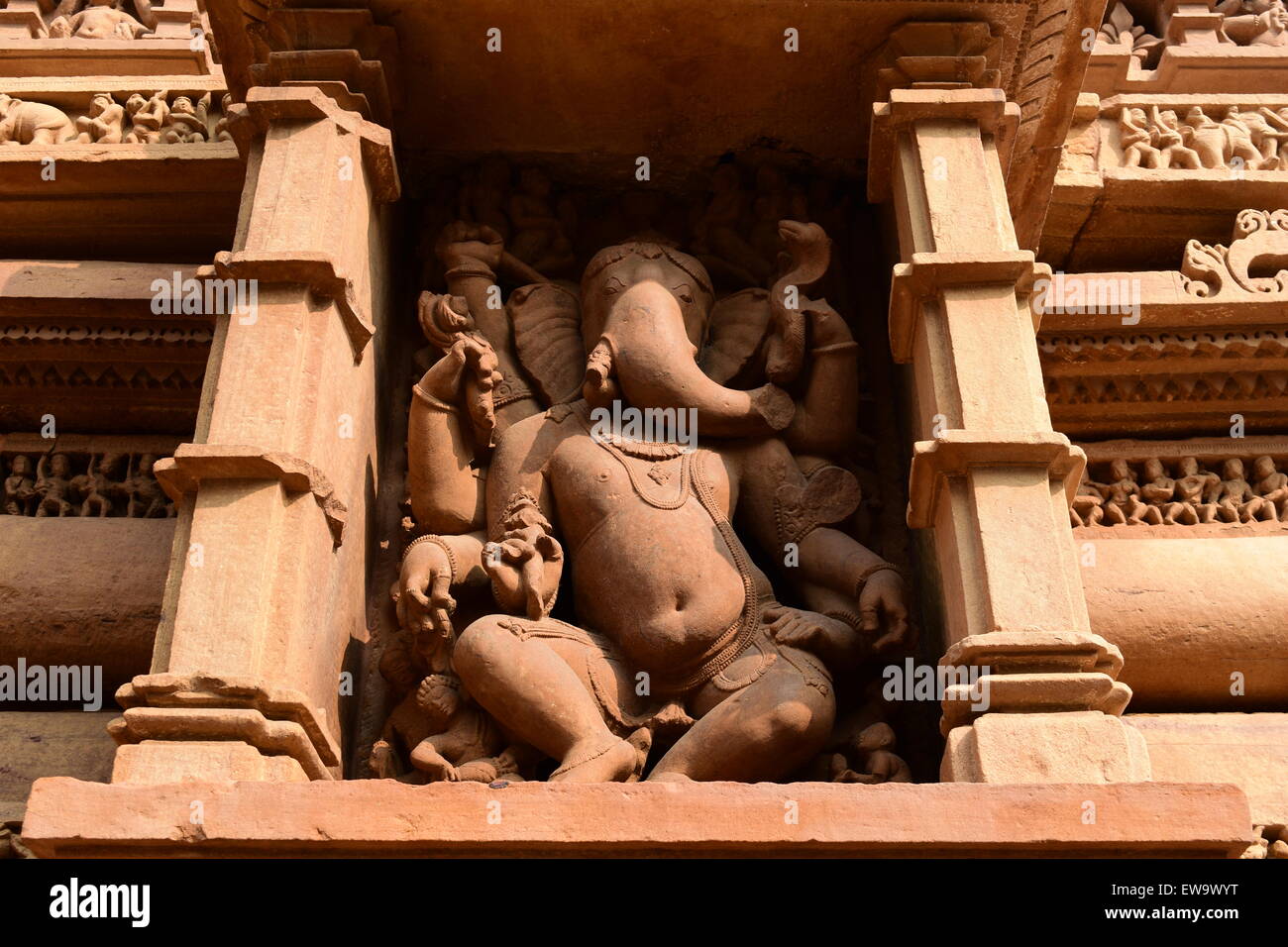 Khajuraho Dancing Ganesha God Ancient stone carved Sculpture on Khajuraho Temple India Ganesh God Statue Stock Photo