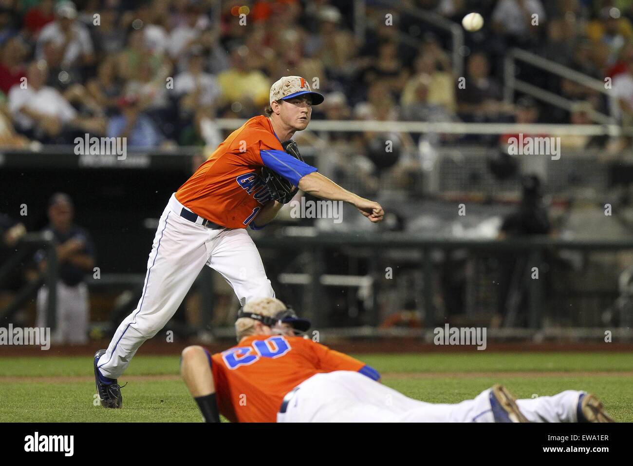 Omaha, Nebraska, USA. 20th June, 2015. Virginia pitcher Tommy Doyle (16) fields a bunt and throws to first during the College World Series game between Florida and Virginia at TD Ameritrade Park in Omaha, Nebraska on June 20th, 2015. Credit:  Mark Kuhlmann/ZUMA Wire/ZUMAPRESS.com/Alamy Live News Stock Photo