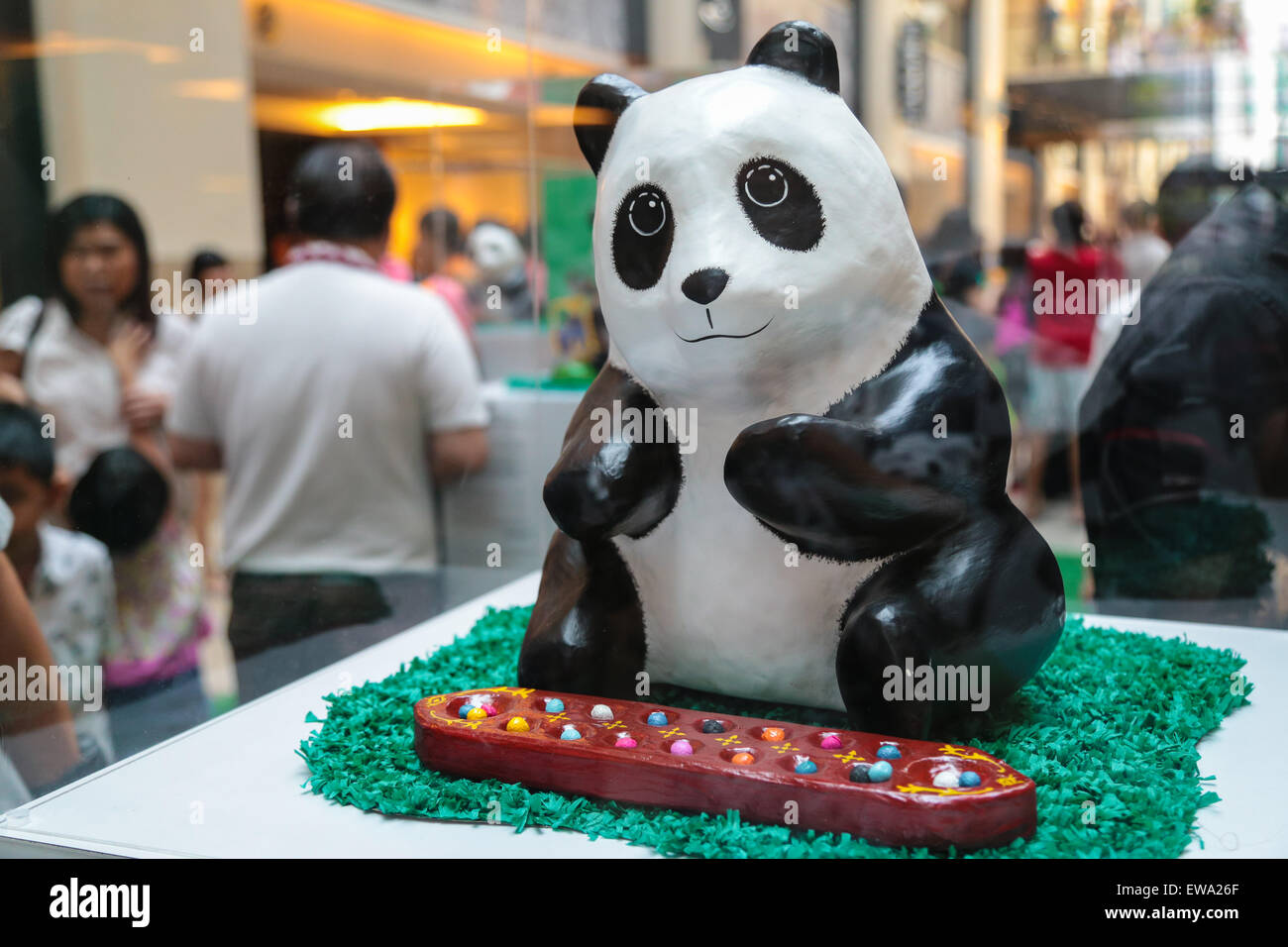 Mache panda playing congkak at 1600 Pandas campaign by WWF at Publika shopping mall, Kuala Lumpur Malaysia 2015 Stock Photo