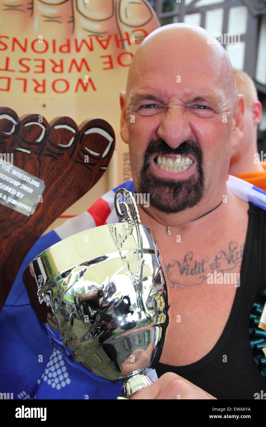 Veteran world toe wrestling champion, Alan 'Nasty' Nash, celebrates after being crowned overall winner of the contest, 2015, UK Stock Photo