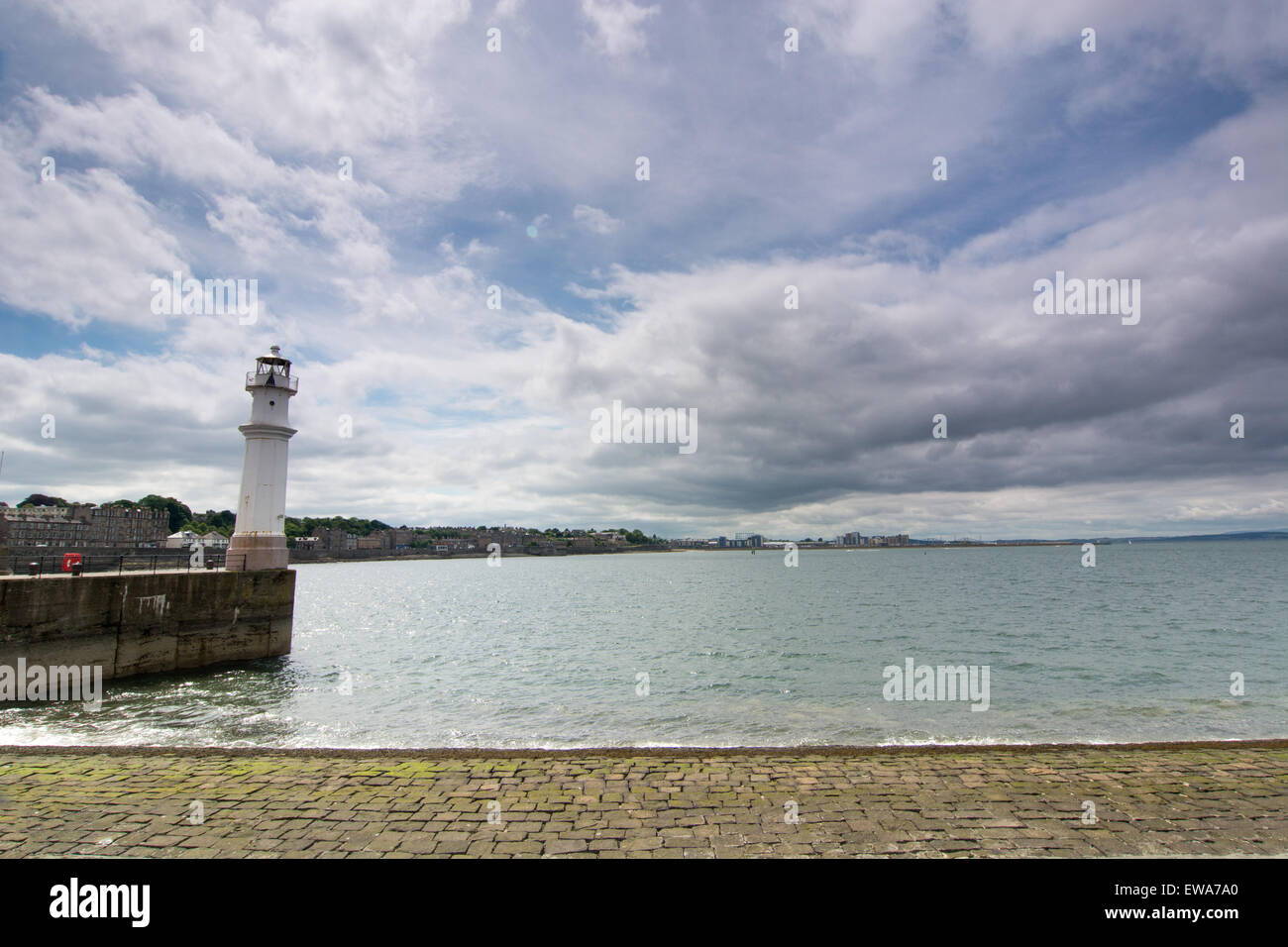 Lighthouse in Newhaven harbour on a sunny day - Edinburgh, Scotland Stock Photo