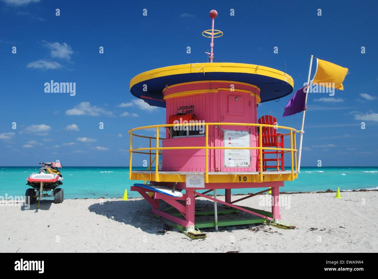 Pink and yellow, round art deco lifeguard station and beach buggy, South Beach, Miami, Florida, USA Stock Photo