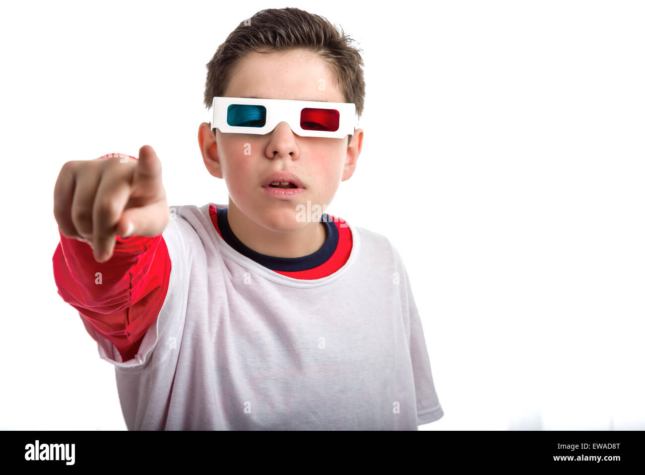 A Soft skinned Latinsleepy boy wears a pair of 3D Cinema paper eyeglasses  with red and sky-blue lenses and astonished and incredulous points to  viewer with right hand Stock Photo - Alamy