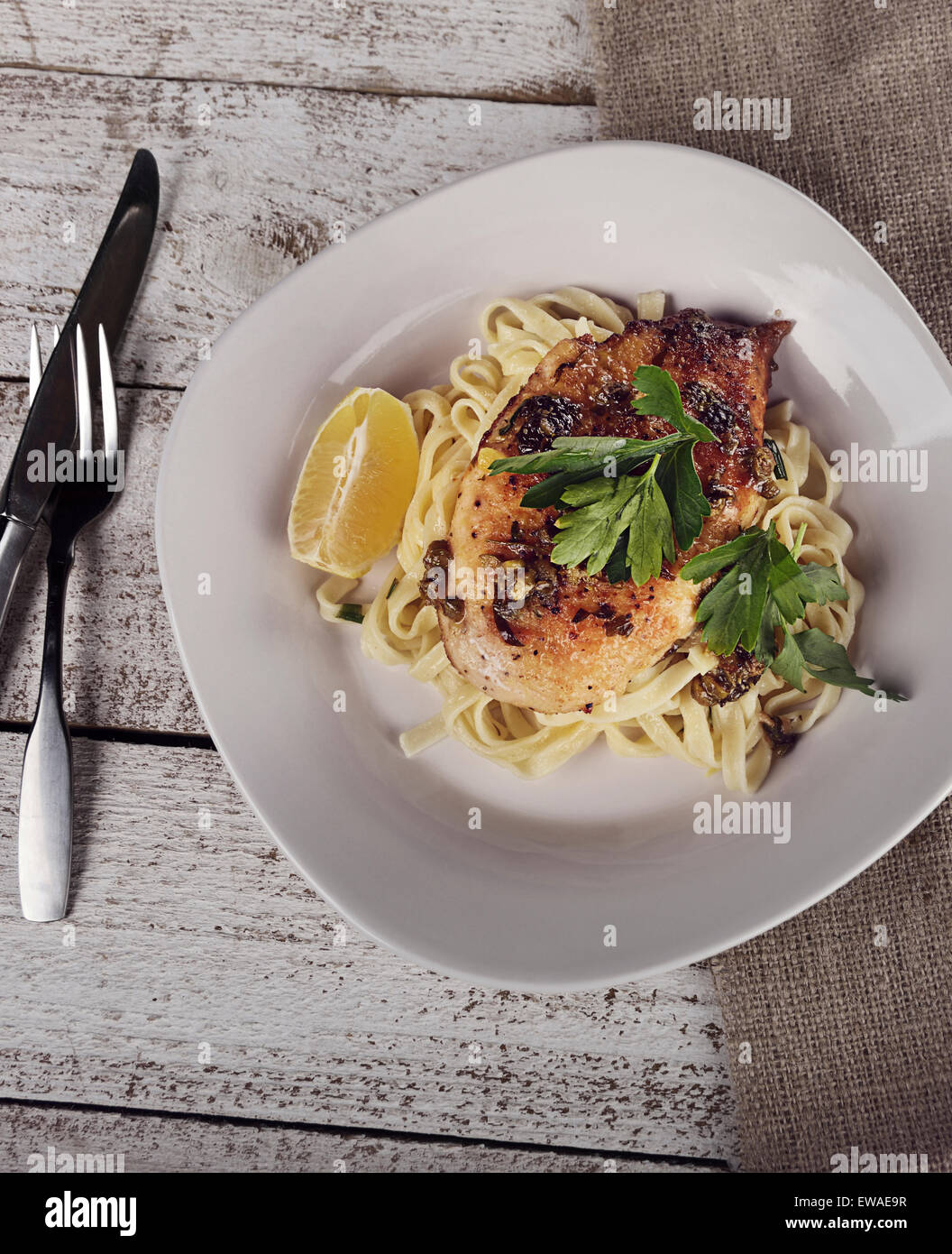 Chicken Fillet With Pasta,Parmesan Cheese And Capers Stock Photo Alamy