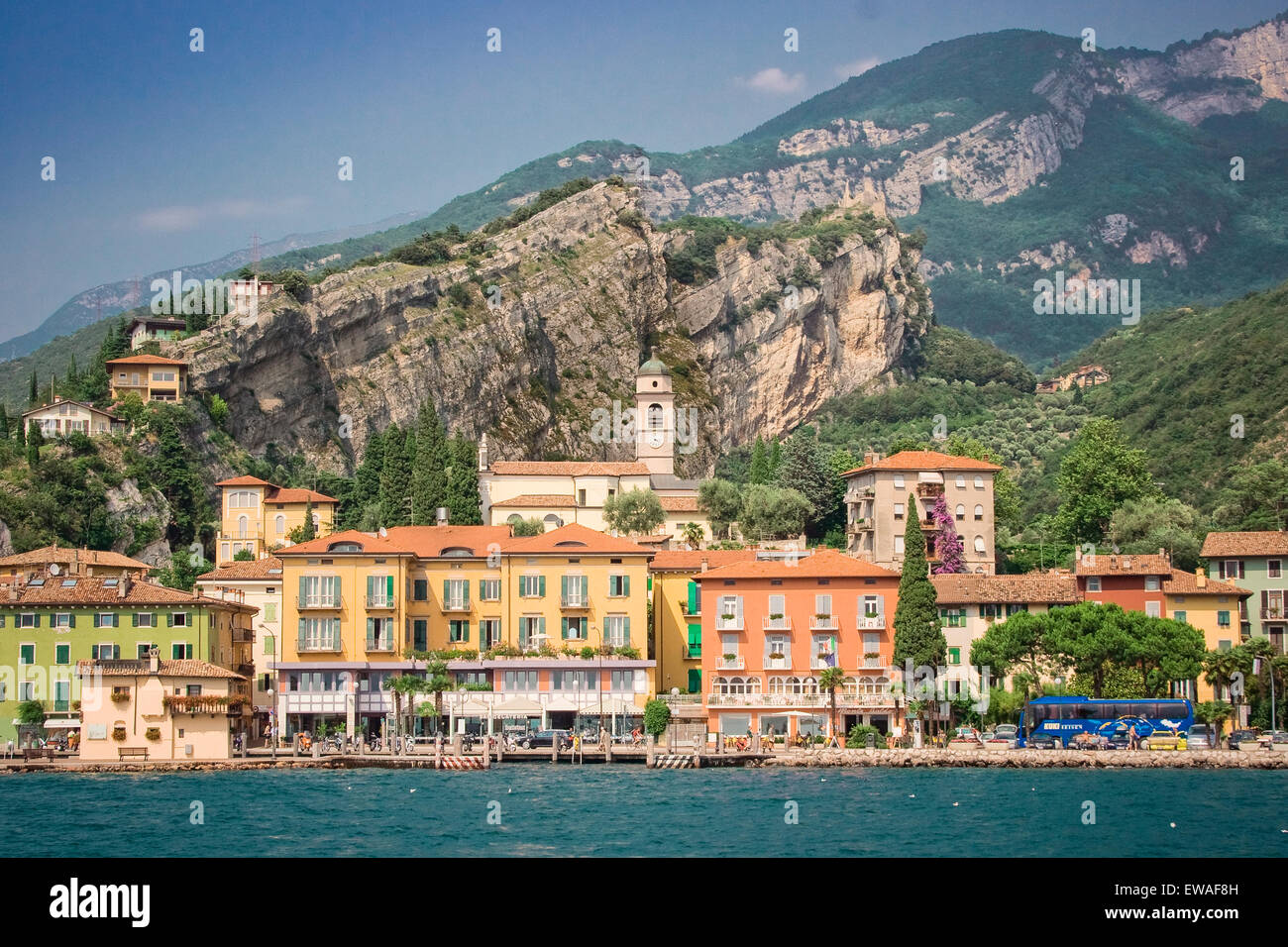 A view of this unique and colorful town Riva on Lake Garda in Italy, showing the land mass behind, a geographical feature. Stock Photo