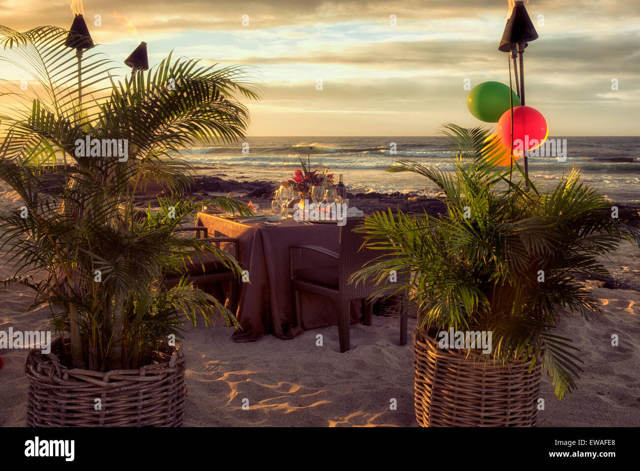 Dinner table set at beach side of the Four Seasons. Hawaii, the big island Stock Photo