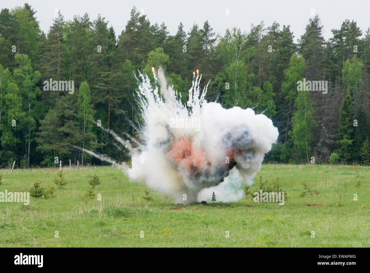 Image of explosion on field during military actions Stock Photo - Alamy