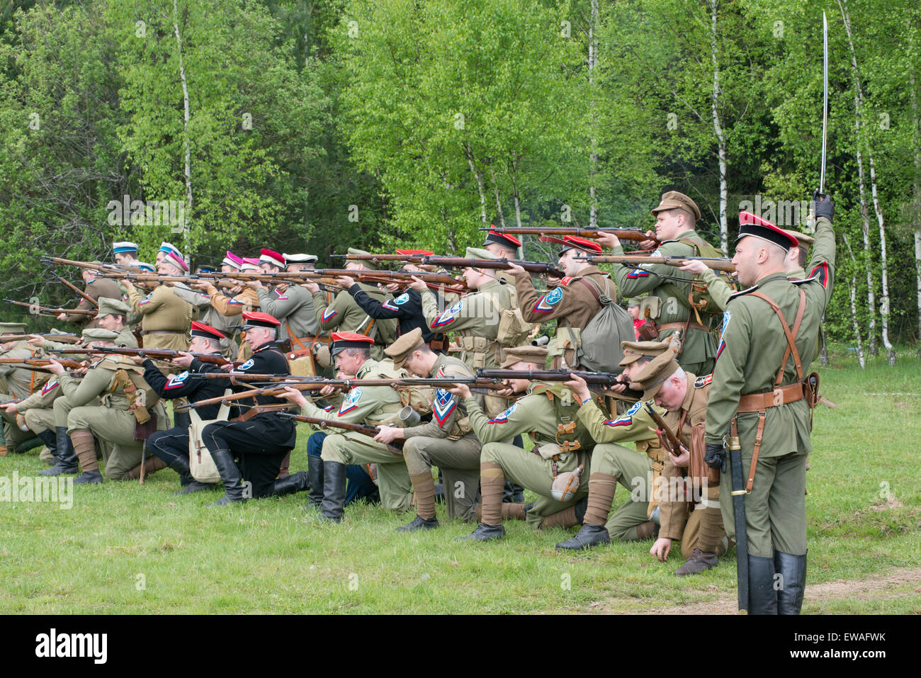 RUSSIA, CHERNOGOLOVKA - MAY 17: Kornilovs hiking squad shooting from rifles on History reenactment of battle of Civil War in 1914-1919 on May 17, 2014, Russia Stock Photo