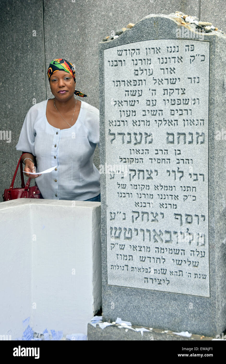 Portrait of a religious Catholic woman praying at a Jewish holy site in Cambria Heights, Queens, New York Stock Photo