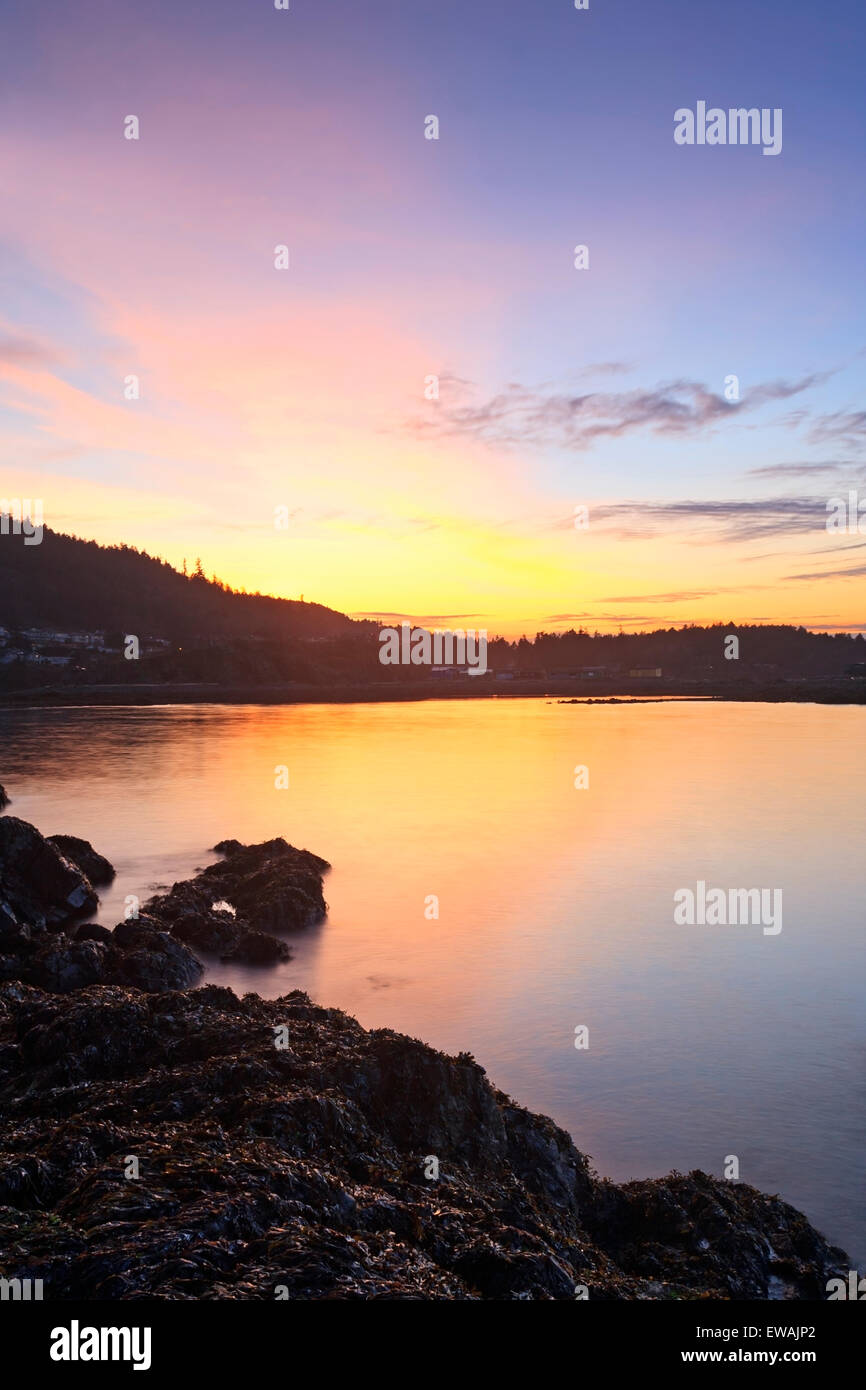 Sunset across Hammond Bay from Pipers Lagoon Park, Nanaimo, BC Stock Photo