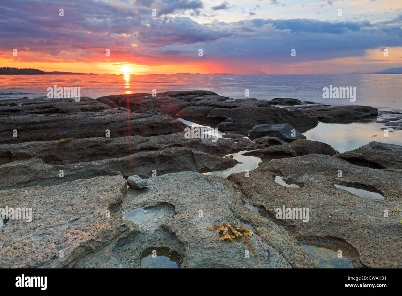 Sunset over Georgia Strait from beach in north Nanaimo, Vancouver Island, British Columbia Stock Photo