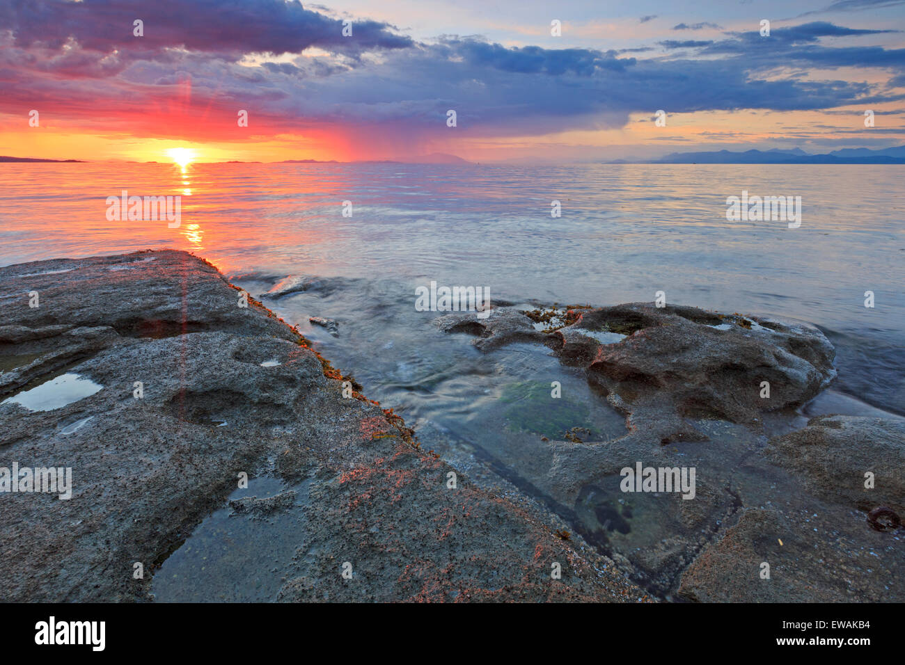 Sunset over Georgia Strait from beach in north Nanaimo, Vancouver Island, British Columbia Stock Photo