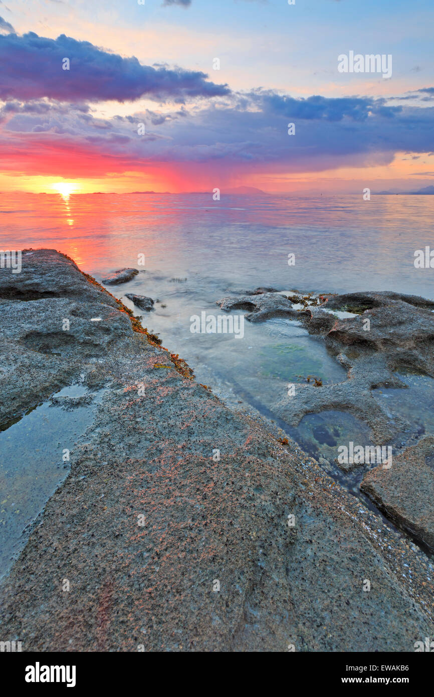 Sunset over Georgia Strait from beach in north Nanaimo, Vancouver Island, British Columbia Stock Photo