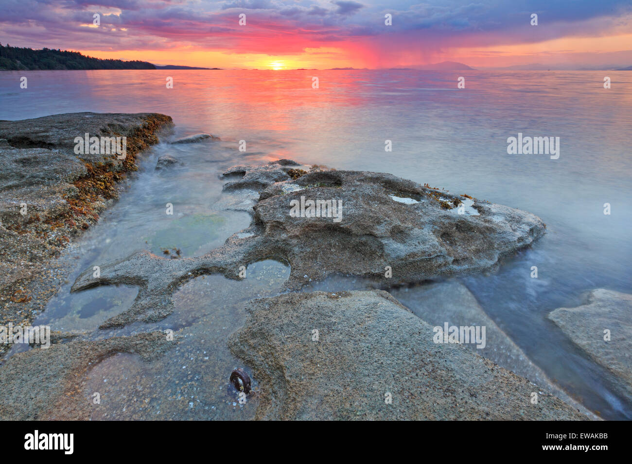 Sunset over Georgia Strait from beach in north Nanaimo, Vancouver Island, British Columbia Stock Photo