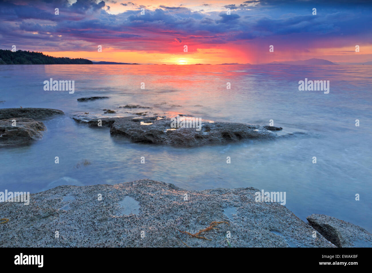 Sunset over Georgia Strait from beach in north Nanaimo, Vancouver Island, British Columbia Stock Photo