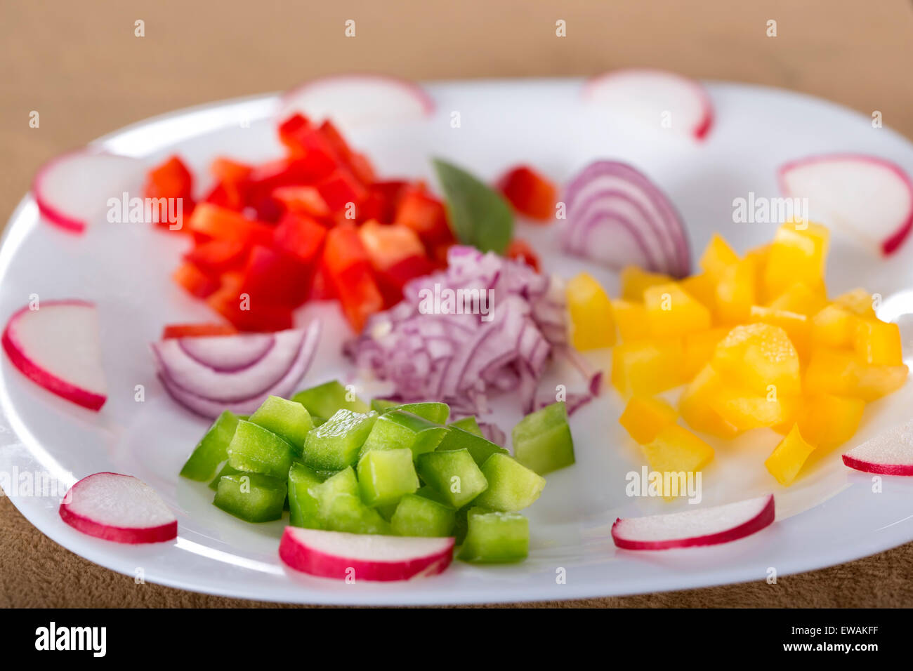 Fresh chopped vegetables on white plate for salad Stock Photo