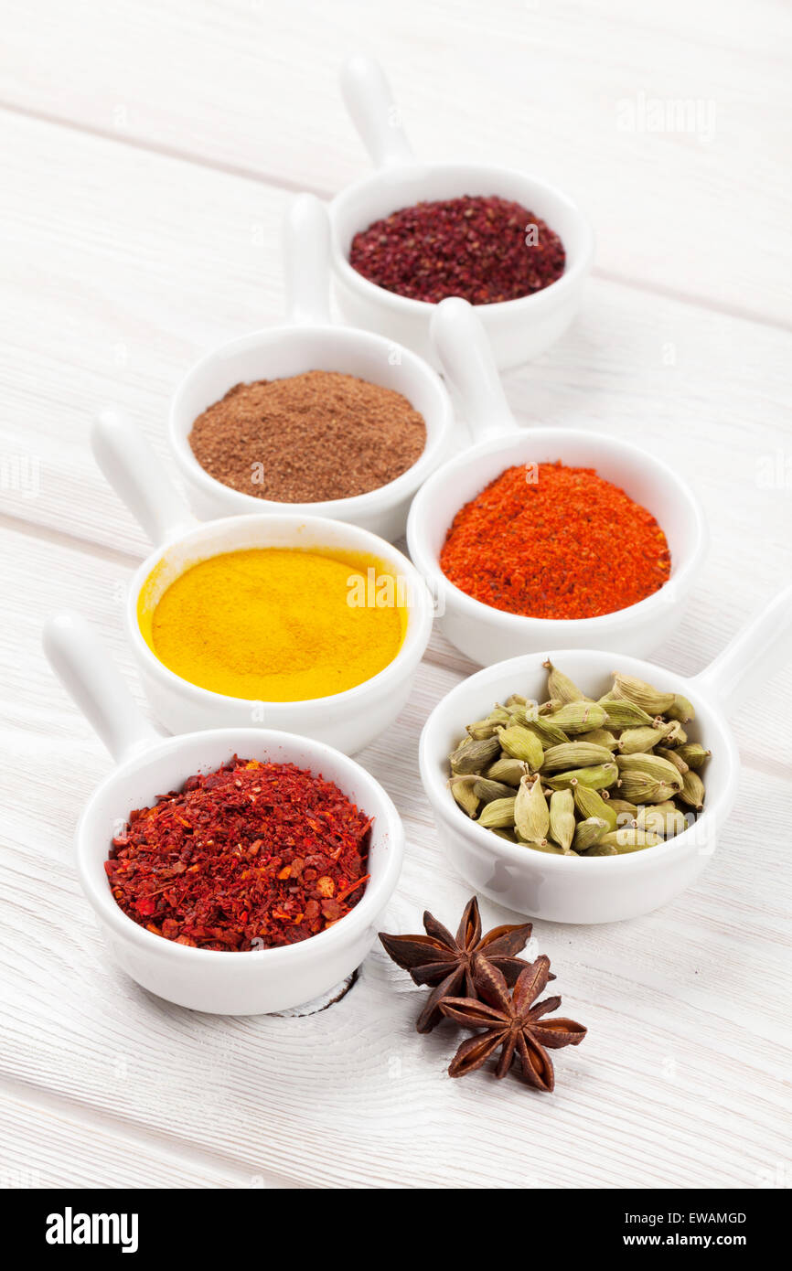 Various spices on white wooden background Stock Photo