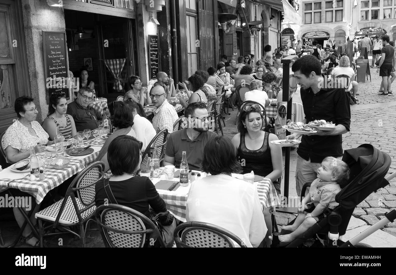 Lyon France busy restaurants in old part of the city dining diners Lyonnaise cuisine. Lyon restaurant Stock Photo