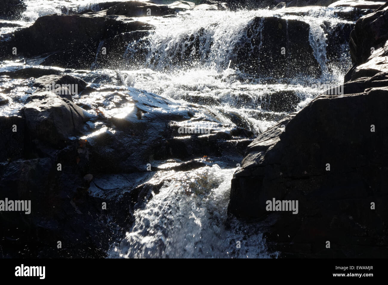 Running White Water over the Rocks Stock Photo