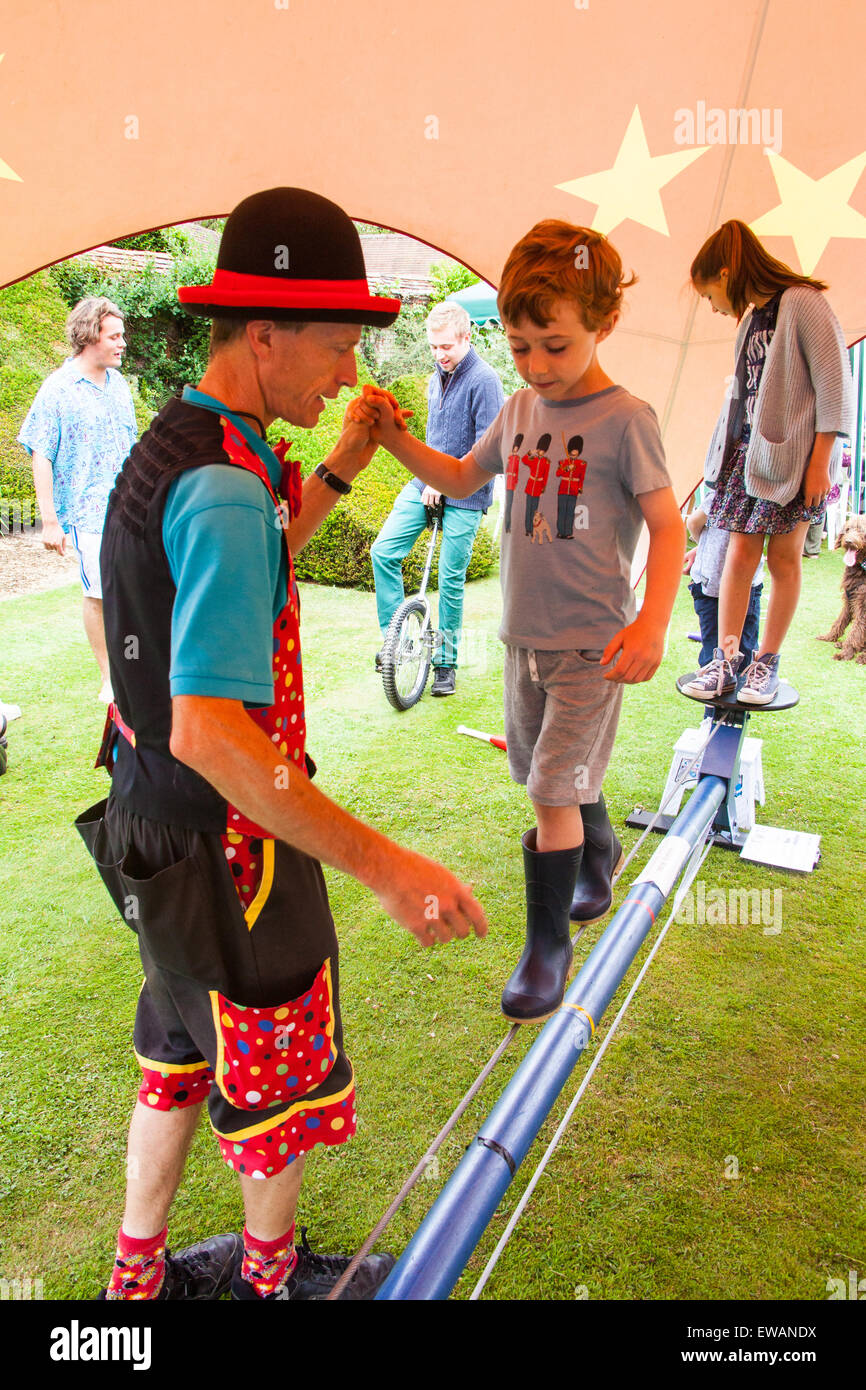 Tightrope walking at the Charity Duck racing at Weir House, Alresford, Hampshire, England. Stock Photo